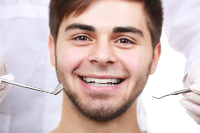 man receiving dental care at Broadwing Dental Studio