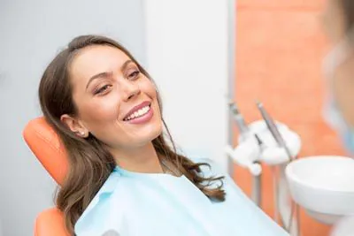 woman smiling during cosmetic care at Broadwing Dental Studio