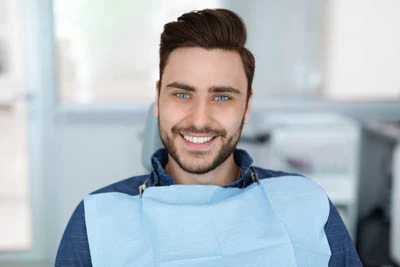 man smiling during his visit to Broadwing Dental Studio