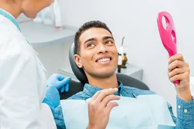 man smiling during his visit to Broadwing Dental Studio