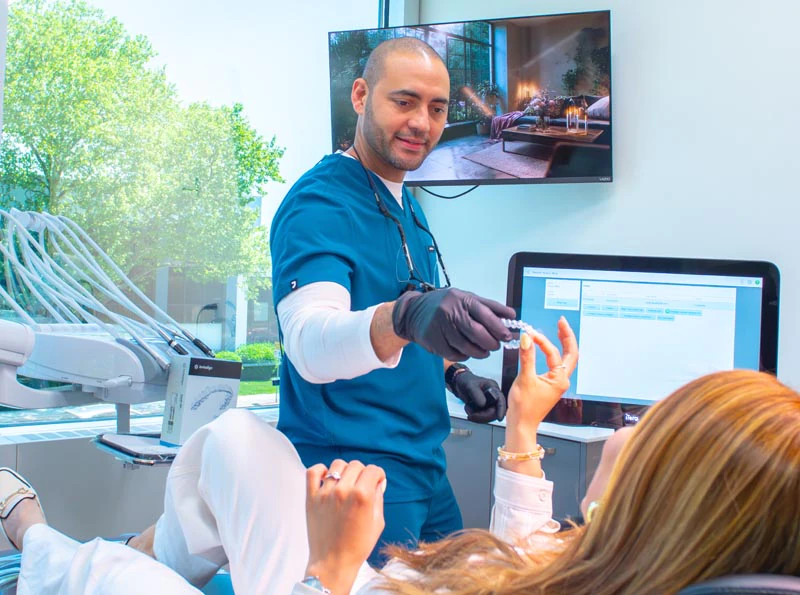 Dr. Soto working with an Invisalign patient