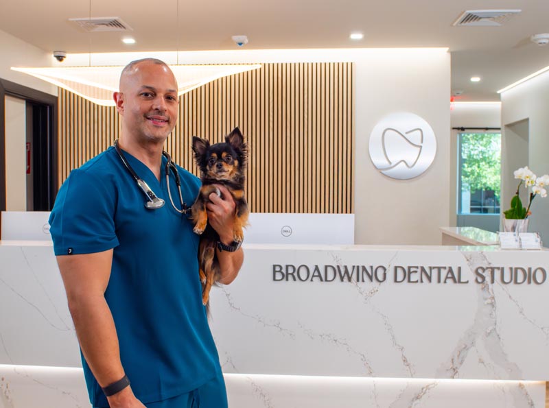 Dr. Soto standing in the Broadwing Dental Studio waiting room